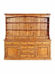 an old wooden dresser with drawers and cupboards on the top, against a white background