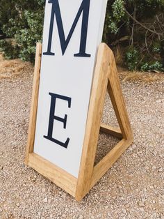 a wooden sign with the word me on it