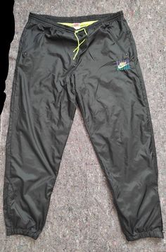 Vintage trackpants from the 90s With lining, 2 zipped pockets and zipped leg opening Important - please note, there is a repaired hole on the front part(see picture) Size M(for the height 178-180 cm) Full length 109 cm In seam 79 cm Front rise 32 cm Waist up to 59 cm(flat measurement(for round X2)) Vintage Nike Pants, Nike Vintage, Picture Size, The 90s, Nike Pants, Latvia, Vintage Nike, Picture Sizes, Track Pants