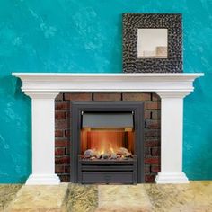 a fireplace with a blue wall in the background