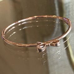 New Rose Gold Bangle Bracelet By Kate Spade. A Bow On The Top And A Box Tab Insert Clasp. Feminine Rose Gold Metal Jewelry, Kate Spade Formal Bracelet Jewelry, Kate Spade Formal Bracelet, Formal Kate Spade Bracelet, Kate Spade Bangle Bracelet For Formal Occasions, Kate Spade Formal Bangle Bracelets, Kate Spade Formal Bangle Bracelet, Kate Spade Elegant Bangle Jewelry, Dainty Rose Gold Bracelets For Party