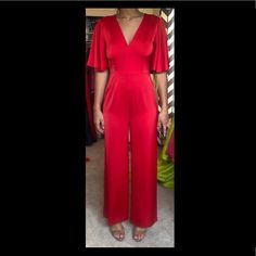 V Neck, Cape Sleeves, Wide Leg.. Adorable And The Material Feels Amazing. Red Fitted V-neck Jumpsuit, Elegant Red Stretch Jumpsuits And Rompers, Red V-neck Jumpsuits And Rompers, Red Summer Formal Jumpsuits, Elegant Red Jumpsuits And Rompers For Date Night, Chic Red Short Sleeve Jumpsuits And Rompers, Red Fitted V-neck Jumpsuits And Rompers, Red V-neck Fitted Jumpsuit, Red Stretch Jumpsuit For Date Night