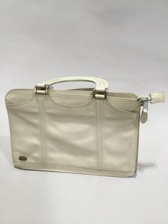 A fantastic piece of vintage fashion. This is a very lightly worn authentic vintage top handle bag from the 1970's. This makes a really great addition to your vintage and modern wardrobe. Vintage Satchel Shoulder Bag With Adjustable Handle, Vintage White Tote Shoulder Bag, Vintage Shoulder Bag With Adjustable Handle For Daily Use, Vintage White Top Handle Shoulder Bag, Vintage White Handheld Shoulder Bag, Vintage White Bags For Travel, Vintage Satchel With Adjustable Handle, Vintage Tote Bag With Adjustable Handle, Vintage White Travel Bag