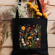 Elevate your style with this Black Floral Pattern Print Tote Bag! Crafted from cotton materials, this botanical print carry bag is perfect for daily use or as a stylish purse. Thoughtfully designed, it's the ideal gift for her on birthdays or Christmas. Add a touch of nature to her wardrobe today! This 100% cotton bag comes in one size - 15" x 16"- perfect for everyday wear. While the canvas material will show off your designs in great colors, it's durable and will last for years. The bag featur Black Bags With Floral Embroidery For Spring, Casual Cotton Flower-shaped Bag, Everyday Cotton Flower-shaped Shoulder Bag, Daily Use Cotton Canvas Bag With Floral Embroidery, Cotton Flower-shaped Shoulder Bag For Everyday Use, Flower-shaped Cotton Shoulder Bag For Everyday Use, Flower Shaped Cotton Shoulder Bag For Everyday Use, Floral Print Cotton Shoulder Bag, Everyday Cotton Shoulder Bag With Floral Print