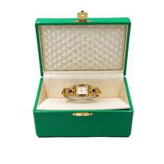 Pre-owned in very good condition Lady’s Tabbah Saga de Tabbah collection known for its unique and modern style, this amazing Swiss-made watch features an elegant rectangular case crafted from precious 18K Yellow Gold and measures approximately 25mm (from end of case to end of crown) x 6.5mm (high). The case is topped with an amazing Diamond-studded 18K Yellow Gold bezel and Rubies approximately 4.87 cts. Behind the high-quality crystal is a superb White guilloche dial with applied dots hour mark Swiss Made Watches, House Gifts, Fine Watches, Gold Case, Ruby Diamond, Swiss Made, Watches Jewelry, Jewelry Creation, Diamond Studs