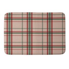 a red and green plaid bath mat on a white background