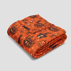 an orange and black halloween themed blanket