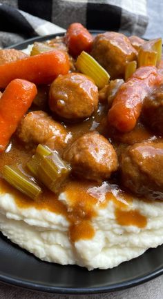 meatballs and carrots are on top of mashed potatoes