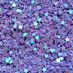 purple and blue stars are scattered on the ground, as if they were glitters