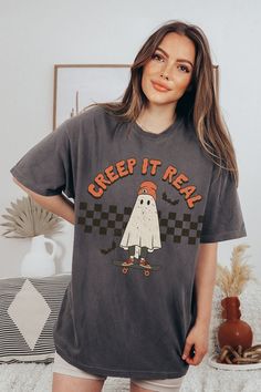 🌙 👻🌙 Creep It Real this Halloween in our Retro Ghost Meme shirt. Printed on vintage inspired Comfort Colors shirt, it's the perfect comfy fit to see you through the spooky season 🌙 👻🌙  Lime Cordial styles are cool AF....just ask our customers! Exclusively designed by authentic 90s B*tches obsessed with pop culture Made in the U.S  PLEASE READ THE DESCRIPTION BEFORE PURCHASING  ✿ To ensure the desired fit, please refer to our UNISEX TEE SIZE CHART in the pictures for details! ✿ Available shirt sizes: S - 3XL (relaxed fit) ✿ ROLLED SLEEVES IN PICTURES ARE FOR STYLING PURPOSES ONLY. ✿ PLEASE BE AWARE We're recreating the aged look of an old-school, worn-out design that has been washed so many times the ink has been cracking and chipping off for years.   ✿✿ PLEASE NOTE: Due to the handma Ghost Meme, Vintage Ghost, Retro Ghost, Creep It Real, Rolled Sleeves, Ghost Halloween, Comfort Colors Shirt, Fall Shirt, Retro Halloween