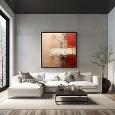 a living room filled with furniture and a large painting hanging on the wall above it