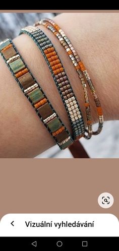 the bracelets are stacked on top of each other and have different beads in them