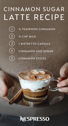 a person holding a cup of cinnamon sugar latte recipe