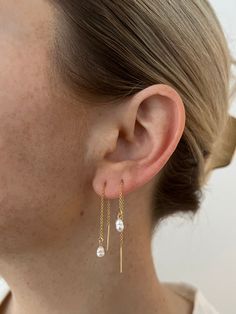 We are in love with this threader style earring! We added a tiny freshwater pearl to elevate this look even more 14k gold filled, water and tarnish resistant Long Delicate Earrings, Thread Through Earrings, Earring Threaders, Delicate Threader Earrings With Delicate Chain For Gift, 14k Gold Filled Long Drop Threader Earrings As Gift, Dainty Linear Earrings With Delicate Chain For Gift, Delicate Threader Earrings With Chain For Gift, Dainty 14k Gold Filled Threader Earrings As Gift, 14k Gold Filled Yellow Gold Threader Earrings As Gift