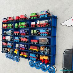 there is a toy train display on the wall