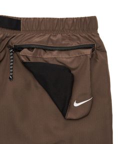 The Men's Nike Swim Belted Packable 9" Volley Short offers versatile style for life on the go. A packable, zippered back pocket converts into a built-in bag for condensed storage and easy carrying. Plenty of pockets keep everyday essentials on hand and allow water to drain away, including on-seam pockets with mesh pocket bags, a cargo pocket with perforated woven bellows and an inner mesh media pocket. Comfortable as well as functional, the long swimming trunks have a built-in mesh brief for a s Mens Nike Bag, Popular Swimwear, Boys Swim Shorts, Nike Swim, Sustainable Swimwear, Swimming Trunks, Boys Swim, Swim Skirt, Cargo Pocket