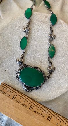 Beautiful Art Nouveau Arts n Crafts Green Chrysoprase Sterling Silver Floral Motif Antique Necklace Necklace measure Approx. 16 inches around Chain Width - Approx. 10 mm Weighs - 30 grams Oval Chrysoprase Gemstone Necklaces, Oval Chrysoprase Gemstone Necklace, Vintage Oval Jade Necklace, Formal Cabochon Chrysoprase Jewelry, Green Oxidized Pendant Necklace, Emerald Cabochon Pendant Necklace, Antique Oval Necklace With Natural Stones, Green Cabochon Bohemian Necklaces, Green Bohemian Cabochon Necklaces