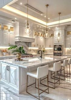 a large kitchen with marble floors and white cabinets