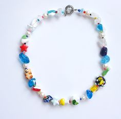 a bracelet with colorful beads and charms on it