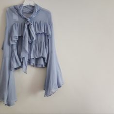 Flounced Ruffled Blouse Flared Sleeves Back Tie Flared Tiered Sleeves H&M Special Edition Light Blue Bnwt Blue Tie Neck Tops For Spring, Chic Blue H&m Tops, Blue Fitted Tie Neck Tops, Light Blue Blouse For Fall Daywear, Blue Flowy Blouse With Ruffles, Flowy Blue Blouse With Ruffles, Light Blue Flowy Blouse For Spring, Blue Fitted Blouse With Tie Neck, Blue Fitted Tie Neck Blouse