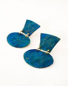 These statement dangle earrings are featuring hand cut brass frames and colorful patina. Geometric vase shaped brass frames are hand cut first and then hand painted with patina and colorful oxides to create old faded/distressed paint effect. Handmade and boho minimalist design, inspired by world travels and terracotta pots Unique and vibrant patina texture on brass featuring blue, turquoise and gold colors Earrings are sealed with few coats of clear glaze to ensure everlasting colors Very lightw Patina Texture, Earthy Blue, White Statement Earrings, Dressy Earrings, Geometric Statement Earrings, Patina Earrings, Blue Minimalist, Unique Handmade Earrings, Geometric Vases