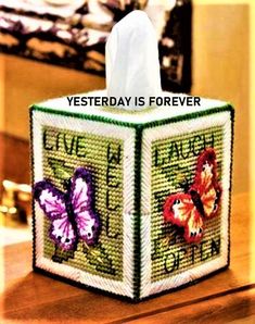 a tissue box with some butterflies on it