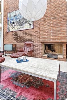 a living room filled with furniture and a fire place