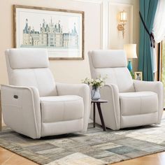 two white recliners sitting on top of a rug