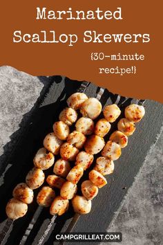 marinated scallop skewers on a grill with text overlay