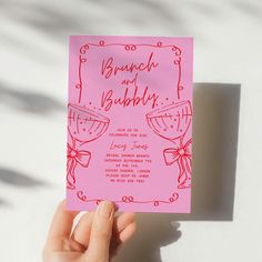 a person holding up a pink card with the words bridal and baby on it