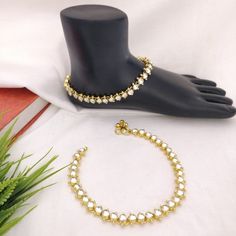 "Kundan Payal/Kundan Anklets/Indian Payal/Indian Anklets/Kundan Anklet/Polki Payal/Green Anklets/Pajeb/Indian Jewelry/Indian Bridal payal Length: 10\" - Indian Kundan Anklets in Golden finish. - Very Elegant and stylish, this set can be paired with any Attire depending upon the occasion and the theme. - The base is pure brass which makes this very sturdy and of good quality. - 100% guarantee on the polish- it will not lose its finish/color/shine. - Very lightweight and Hand carved. - Price is fo White Anklets For Festivals Gift, White Anklets For Festivals And Gifts, Wedding Stone Work Anklets, Wedding Anklets With Stone Work, White Toe Ring Anklets For Festivals, Traditional White Anklets For Festive Occasions, White Wedding Anklets For Festive Occasions, Elegant White Festive Anklet, White Anklets With Latkans