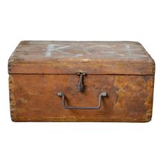 an old wooden box with metal handles