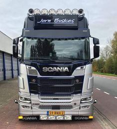 a large truck is parked on the side of the road