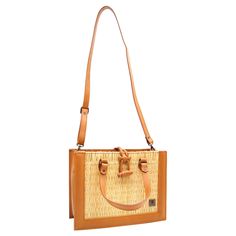 Product Description Classic but bold, this straw handbag is crafted with organic reed allied with vegetable tanning leather details, making it a timeless bag. Handmade using traditional Portuguese woven methods, by a family of master artisans, this is a masterpiece that unites old-world weaving techniques with a modern look. Designed so that you can make the most of your day-to-day life. Take it to the office or on a date and be assured that your outfit will pop from the others. Its removable sh Brown Basket Straw Bag With Bamboo Handle, Straw Bag With Bamboo Top Handle, Straw Top Handle Bag With Bamboo Detail, Brown Rattan Straw Bag With Bamboo Handle, Top Handle Straw Bag With Bamboo Handle, Travel Satchel In Natural Woven Style, Travel Woven Natural Satchel, Natural Rattan Shoulder Bag With Bamboo Handle, Travel-friendly Woven Natural Satchel