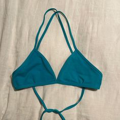 Jolyn Triangle Bikini Top In Teal Blue. Never Worn. Sustainably Made With Recycled Materials. Compression Fabric Designed For Water Activity - Perfect For Surf Or Swim. Blue Swimwear With Built-in Bra And Tie-side Bottom, Blue T-back Halter Top For Poolside, Blue T-back Summer Swimwear, Light Blue Fitted Halter Neck Swimwear, Blue Halter Top With Built-in Bra For Beach Season, Turquoise Fitted Halter Neck Swimwear, Fitted Blue Halter Top For Summer, Blue Strappy Swimwear For Beachwear, Blue Strappy Beachwear Swimwear