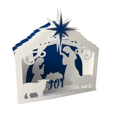 a paper cut nativity scene with the birth of jesus