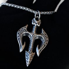 These Unique Poseidon Trident Pendants Will Take Your Fit To The Next Level! Crafted From High Quality 316l Stainless Steel; These Pendants Are Heavy, Strong, And Built To Last! Our Trident Pendants Are 100% Waterproof And Guaranteed Not To Tarnish! You Can Wear Them Wherever You Want: At The Pool, The Beach, As You Sleep, And Even As You Shower! Same Day Usps Shipping We Ship Out These Pendants The Same Day Of Purchase With First Class Usps Shipping! Each Purchase Comes With One Free 24 Inch St Outdoor Engraved Stainless Steel Jewelry, Durable Symbolic Jewelry As A Gift, Durable Silver Jewelry Gift, Symbolic Jewelry As A Gift, Engraved Stainless Steel Jewelry, Durable Silver Necklace For Gift, Durable Stainless Steel Jewelry For Gift, Durable Stainless Steel Necklace For Gifts, Durable Stainless Steel Necklaces For Gifts