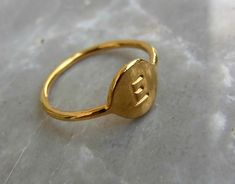 Personalized stamped letter ring.  Made of 14 karat gold plated brass and hand stamped with the letter that you choose.  Great as a birthday gift, for a new mom, sweet sixteen, and valentine. Initial Gold Ring, Sweet Sixteen Gifts, Delicate Gold Ring, Gold Initial Ring, Funky Rings, Liz Taylor, Sweet 16 Gifts, Engraved Initials, Engraved Ring