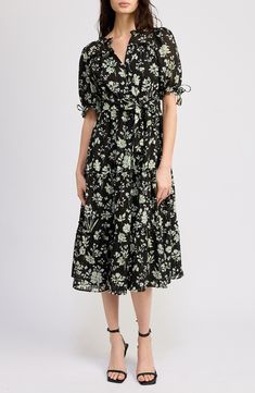 An effervescent floral pattern blossoms on a belted midi dress complete with impeccable puff sleeves. 44" length (size Medium) Front button closure Split neck Short sleeves Removable tie belt Partially lined 98% polyester, 2% spandex Hand wash, line dry Imported Spring Floral Print V-neck Puff Sleeve Dress, Floral Print Non-stretch Short Sleeve Midi Dress, Non-stretch Black Midi Dress With Floral Print, Black V-neck Midi Dress With Floral Print, Black Midi Dress With Floral Print And 3/4 Sleeve, Belted Midi Dress, Floral Print Midi Dress, Printed Midi Dress, Nordstrom Dresses