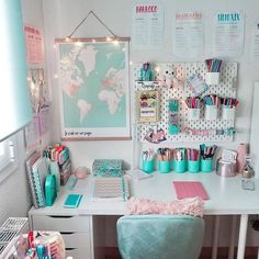 a white desk topped with lots of office supplies