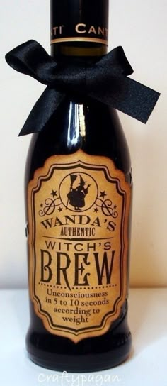 a bottle of beer with a black bow on it