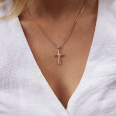 Elegant carved ferns and leaves deliver timeless charm to this Hawaiian Heirloom Cross Pendant. Complete with a natural diamond, this pendant is a symbol of love, honor, and respect. Cherish and pass down this keepsake for generations. Cross Pendant 14k Rose Gold Natural Diamond: 0.05 CTW Measures approx. : 30mm in length x 15.85mm in width ( 1 1/8" x 5/8"), including bail Chain not included, Shop Chains Now Exclusively Made in Hawaiʻi Forever Guarantee (Lifetime Warranty on the life of the piec Engraved Rose Gold Cross Jewelry, Rose Gold Cross Jewelry With Diamond Cut, Personalized Rose Gold Cross Pendant Jewelry, Personalized Rose Gold Cross Jewelry, Medium Cut, Rose Gold Pendant, Scroll Design, Cross Designs, Old English