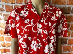 "Vintage RJC ltd. hawaiian men's red shirt floral print size large. Excellent condition, front pocket, 100% cotton. Made in Hawaii, Usa. Please, check carefully the measurements, photos and description of the article before buying it, we do not accept changes or returns. Measuraments lying face down from outside: 21\" Across chest underarm to underarm. 18 1/2\" Shoulder seam to seam.. 10\" Sleeve length from shoulder seam to cuff. 30\" Long, front middle top to bottom. Let me know if you have an Red Floral Print Hawaiian Shirt For Spring, Red Floral Hawaiian Shirt For Spring, Red Floral Print Hawaiian Shirt For Summer, Red Hawaiian Shirt With Camp Collar For Spring, Red Floral Print Hawaiian Shirt With Short Sleeves, Red Printed Hawaiian Shirt With Camp Collar, Red Camp Shirt With Tropical Print, Red Tropical Print Camp Shirt With Camp Collar, Beach Hawaiian Shirt With Floral Print In Red