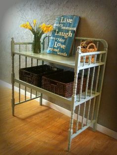 a shelf with baskets and flowers on it