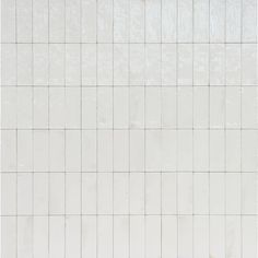 a white tiled wall with no one in it