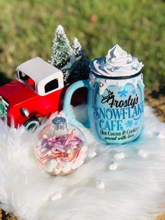 a toy truck with a christmas ornament next to it on a fake fur