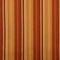 an orange and brown striped curtain with vertical stripes on it's side, in front of a white background