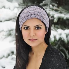 a woman wearing a headband in the snow