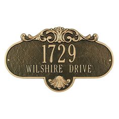 a sign that says 1239, with an ornate border around the front and back