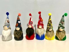 seven gnomes are lined up on a table